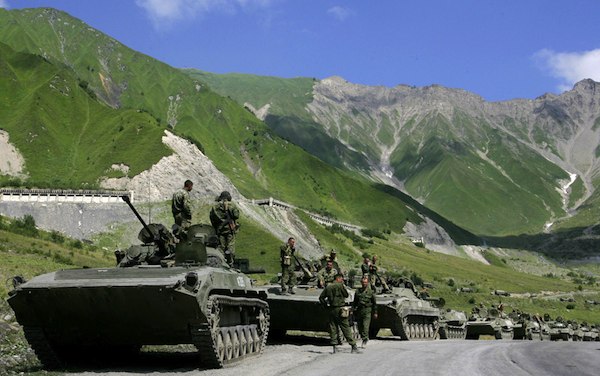 A convoy of Russian troops makes its way through the Caucasus Mountains toward the armed conflict between Georgian troops and separatist South Ossetian troops, in the South Ossetian village of Dzhaba on August 9, 2008. Georgian President Mikheil Saakashvili declared a "state of war" as his troops battled it out with Russian forces over the breakaway province of South Ossetia. (Dmitry Kostyukov