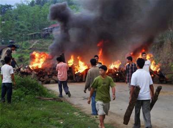 Supporters of Thuingaleng Muivah, General secretary NSCN(IM), blocking National Highway No. 39 with stones and burning firewoods in protest against Manipur government's decision of not allowing the leader to visit his home town Ukhrul, in Senapati on Friday, May 7, 2009.