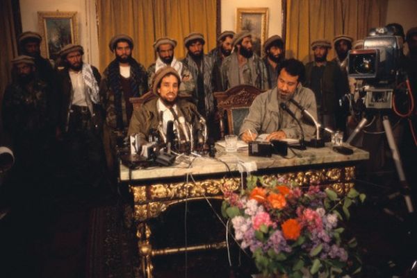 Photo: 1992, Kabul, Afghanistan --- Ahmed Shah Massoud gives a press conference in a Kabul hotel after the Mujahideen seize the city. His political advisor Massoud Khalili takes notes. http://www.flickr.com/photos/53718649@N08/49