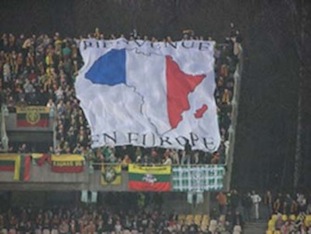 Photo: 2008 banner was displayed at the Lithuania-France Euro qualifiers in March, 2007. It’s an outline of Africa, decorated with the France flag, and reads, “Welcome to Europe” in French. Apparently a way to point out that the Lithuanian team is 100% white. The France team? Much less so. http://www.theoffside.com/world-football/photo-of-the-day-racism-in-lithuania.html