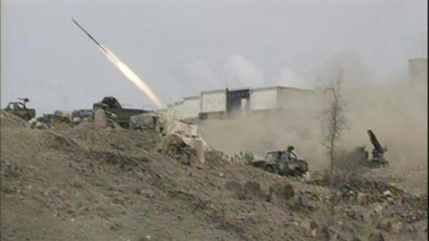 Yemeni army vehicle firing a rocket