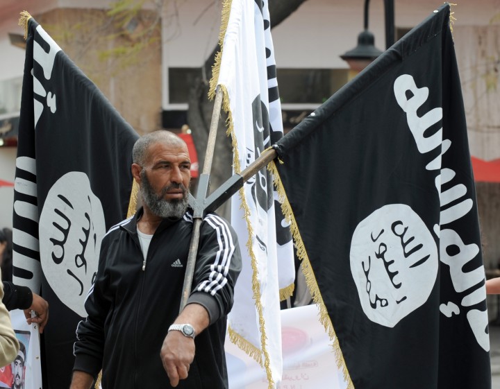 islamist-holds-aloft-isis-flag-demonstration-tunis-getty