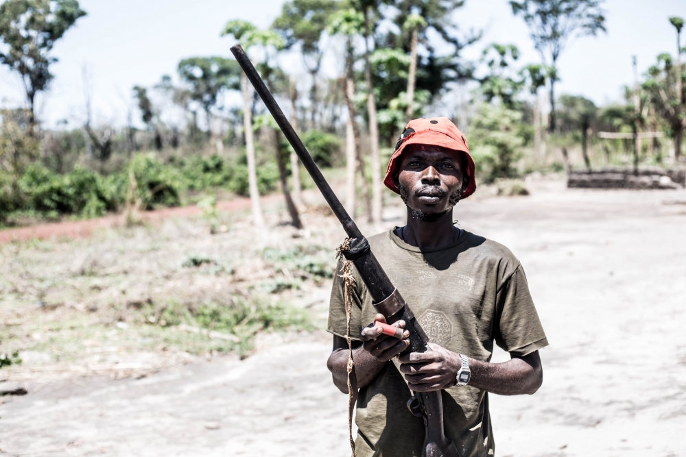 ludovic_valongere_holding_a_newly_built_hunting_rifle_he_says_he_will_use_to_protect_his_family_and_village