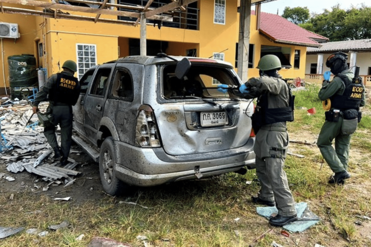 Thai security officers inspect a bomb site after suspected insurgents targeted a local administrative office in Pattani, Thailand,