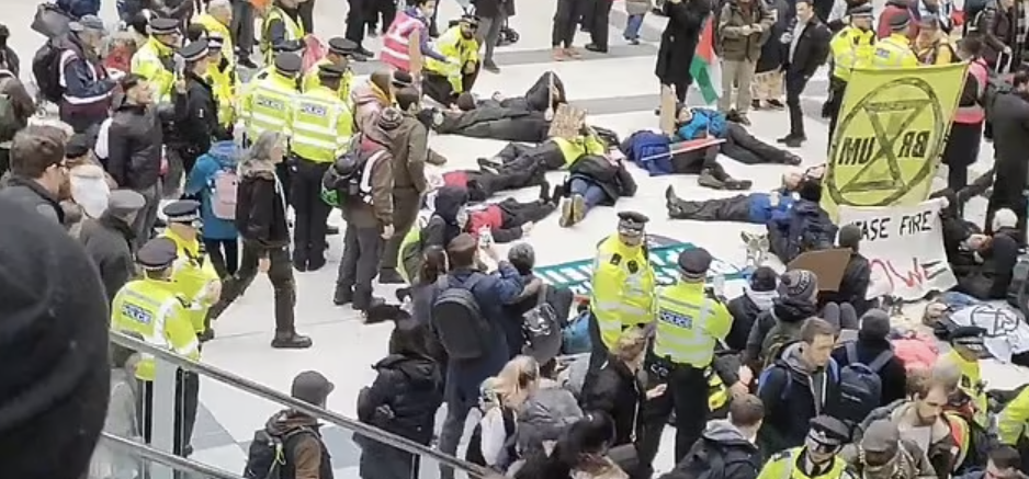Pro-Palestine Activists and Environmentalists of the 'Extinction Rebellion' Group Paralyze Liverpool Street Station in a Joint Sit-In Protest, London, United Kingdom - 29 February 2024
