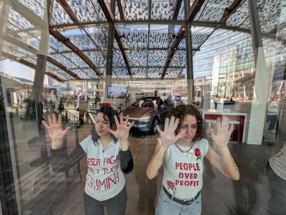 (Video) Activists of the 'Extinction Rebellion' Environmental Group Occupy a Tesla Store in Milan, Lombardy Region, Northern Italy - 07 March 2025